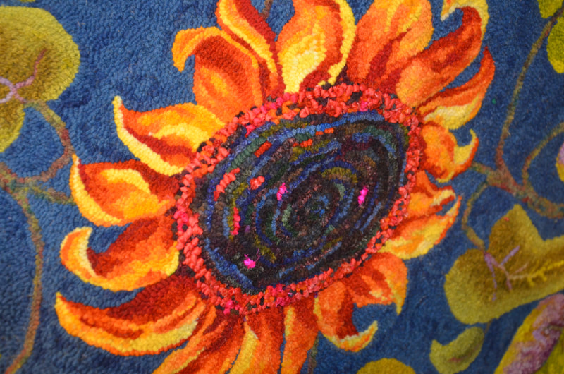 Peggy's use of sari silk to make the center of the sunflower pop.